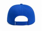 The back view of a royal blue baseball cap with a perforated fabric crown and an adjustable strap, featuring the brand name 'Stitch' printed on the side.