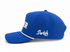 A royal blue perforated baseball cap with white trim and white branding, featuring the 'Swish Golf' logo on the side, set against a plain white background.