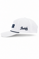 White Swish Golf baseball cap with navy blue embroidered lettering on the side, featuring a perforated front panel and a curved brim, shown against a plain white background.